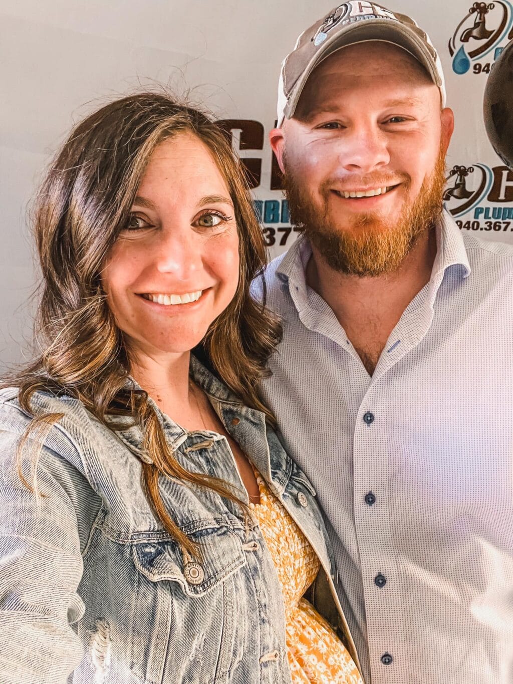 Bearded man in white polo and girl in jacket jeans.
